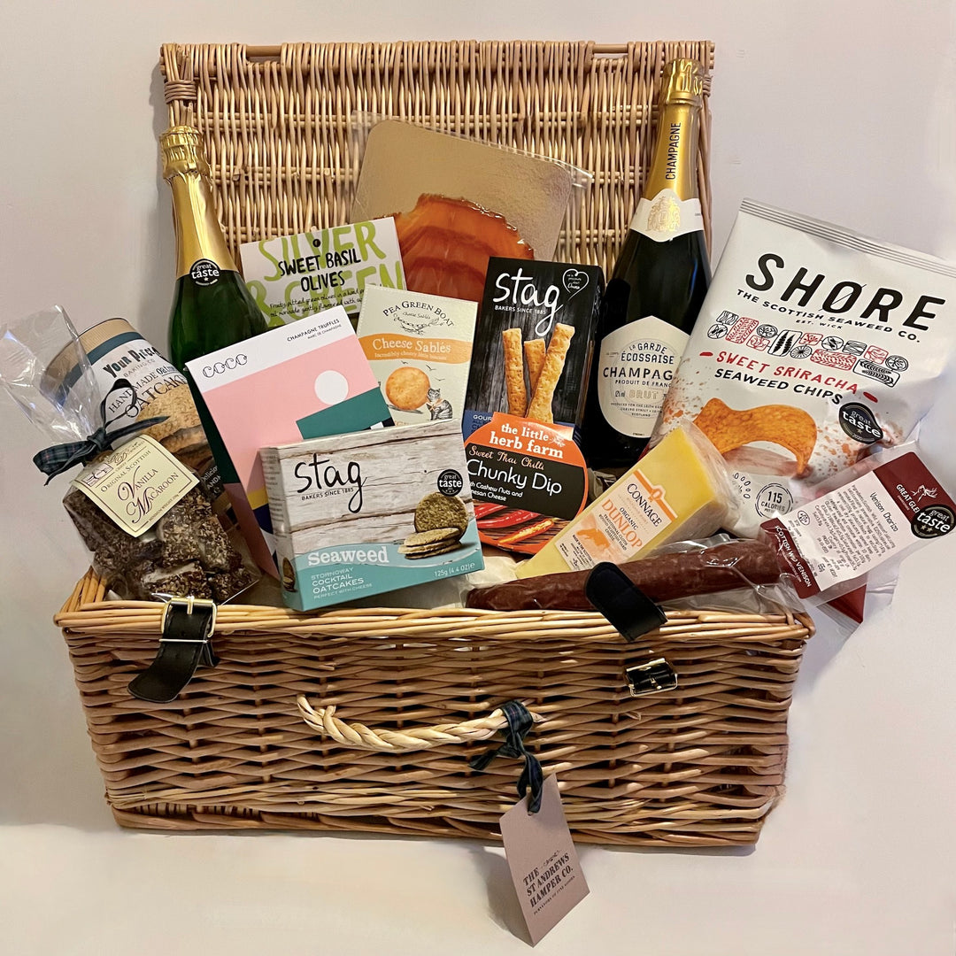 Celebration hamper from The St Andrws Hamper Company, choose from a wicker hamper or large branded jute tote, both filled with 14 yummy food and drink treats.