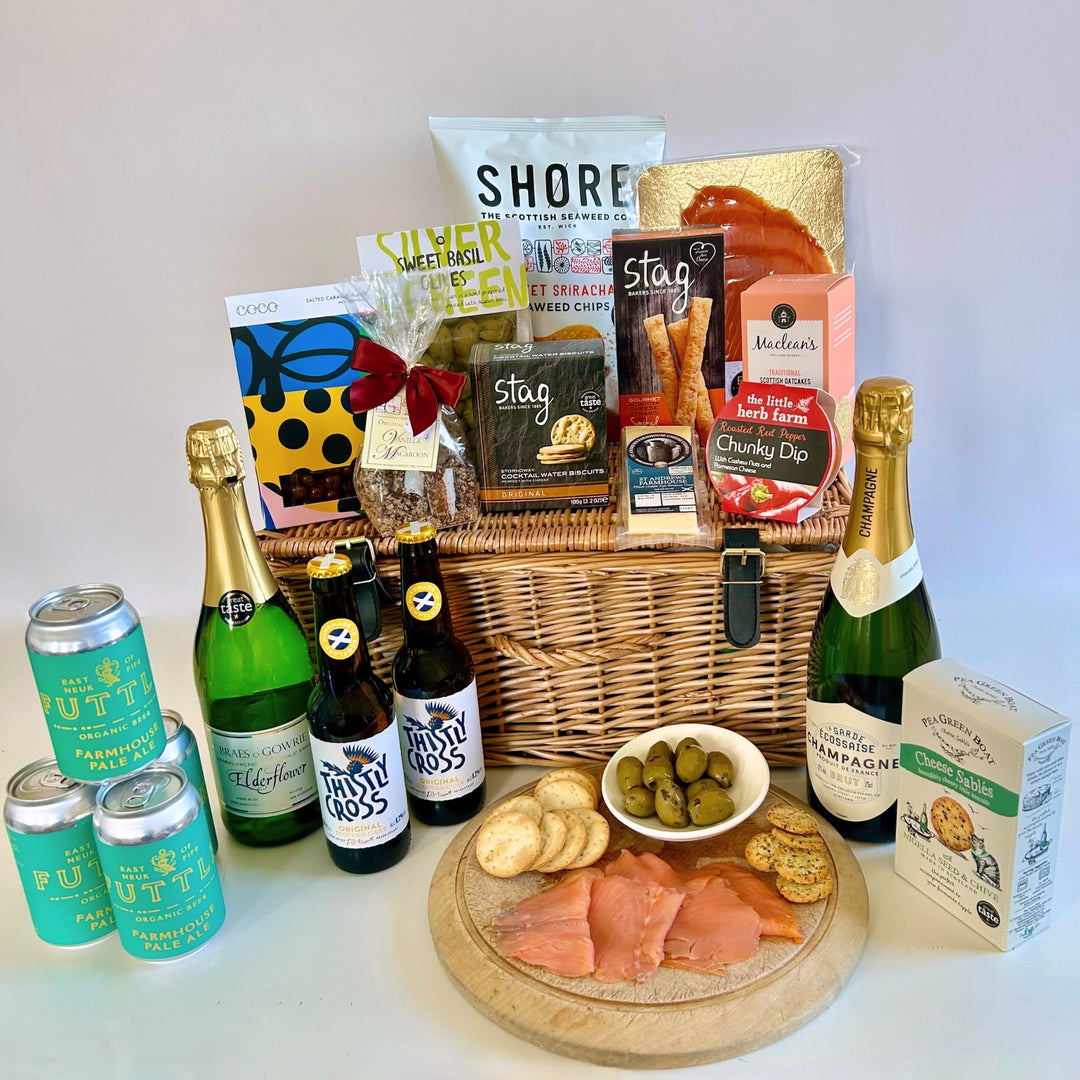 Celebration hamper from The St Andrws Hamper Company, choose from a wicker hamper or large branded jute tote, both filled with 19 delicious food and drink treats.