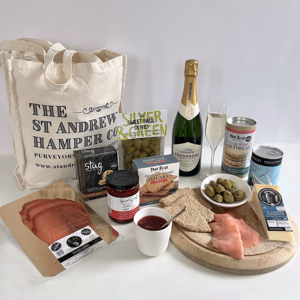 Unique champagne graduation gift hamper with nine sweet and savoury treats carefully sourced from tried and trusted artisan suppliers based around Scotland, presented in our exclusive St Andrews Hamper Company canvas tote.