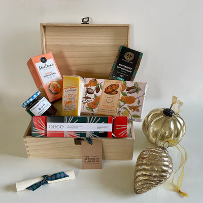 Festive Tuck Box from The St Andrews Hamper Company is filled with seven tasty eco and organic sweet and savoury festive treats, presented in a keepsake wooden box.