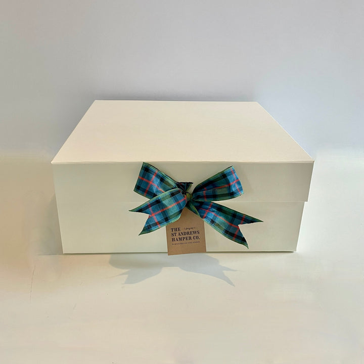 The St Andrews Hamper Company luxury keepsake gift box in ivory with tartan ribbon bow.