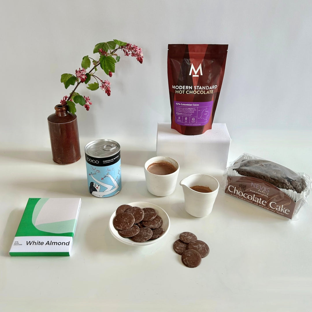  Four luxury chocolate treats from The St Andrews Hamper Company, including Modern Standard hot chocolate, Nevis Bakery chocolate cake, Coco Chocolatier giant milk chocolate buttons and Ocelot white organic chocolate with almonds.