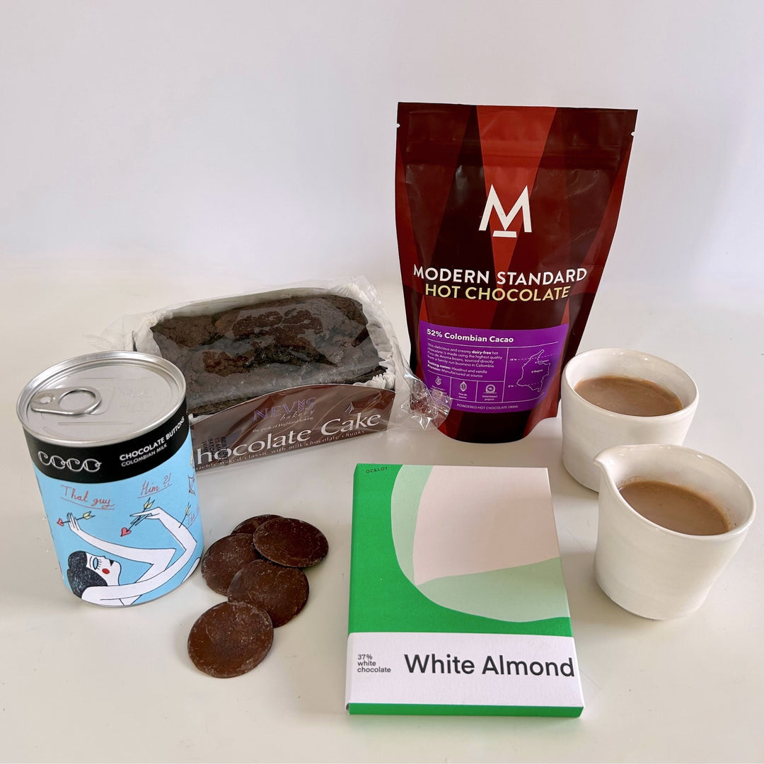 Quartet of chocolate treats from The St Andrews Hamper Company, including hot chocolate, rich chocolate cake, giant milk chocolate buttons and white organic chocolate with almonds.