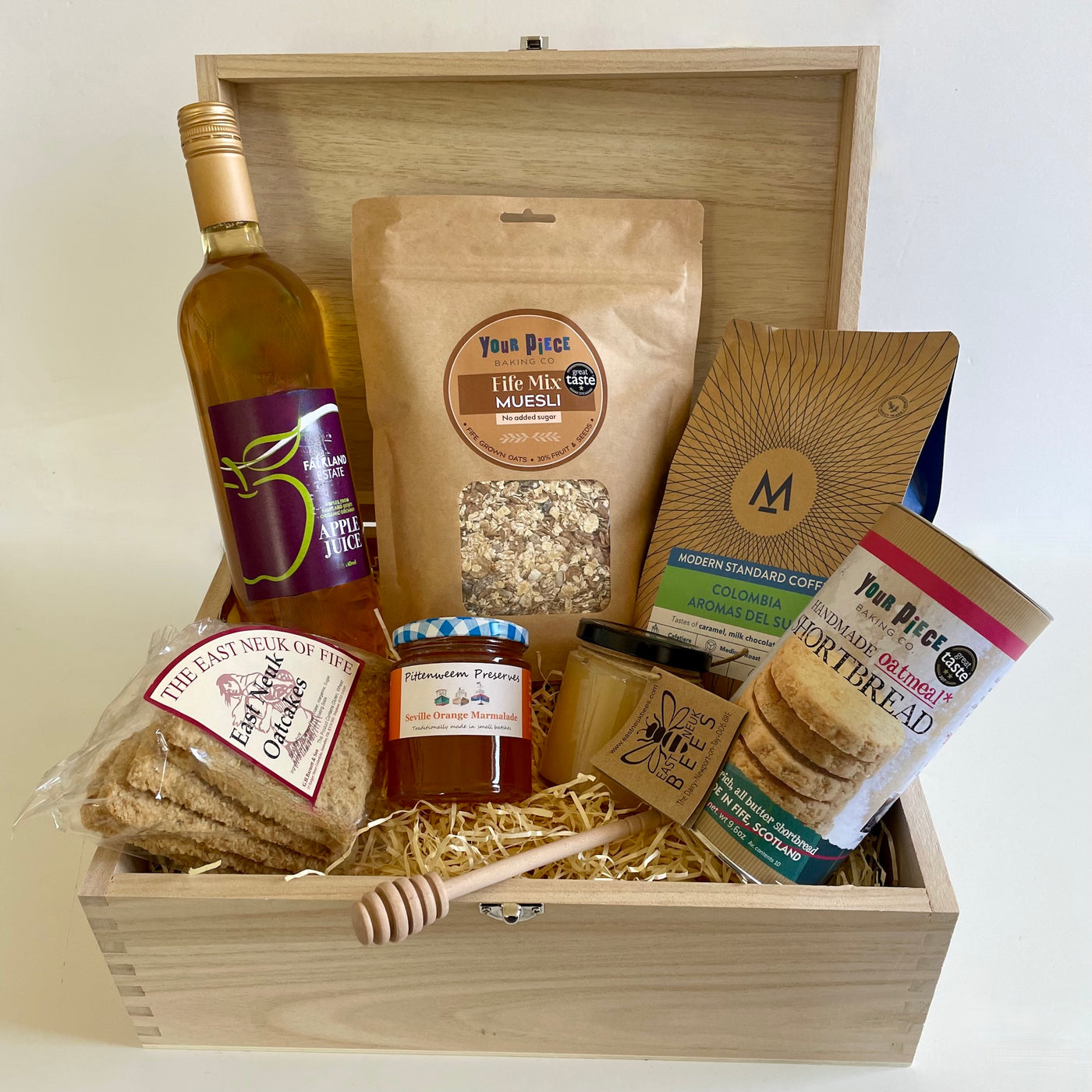 Tastes of Fife Hamper from The St Andrews Hamper Company, with seven tasty eco and organic products made by artisan producers, plus a keepsake wooden tuck box and honey dipper.