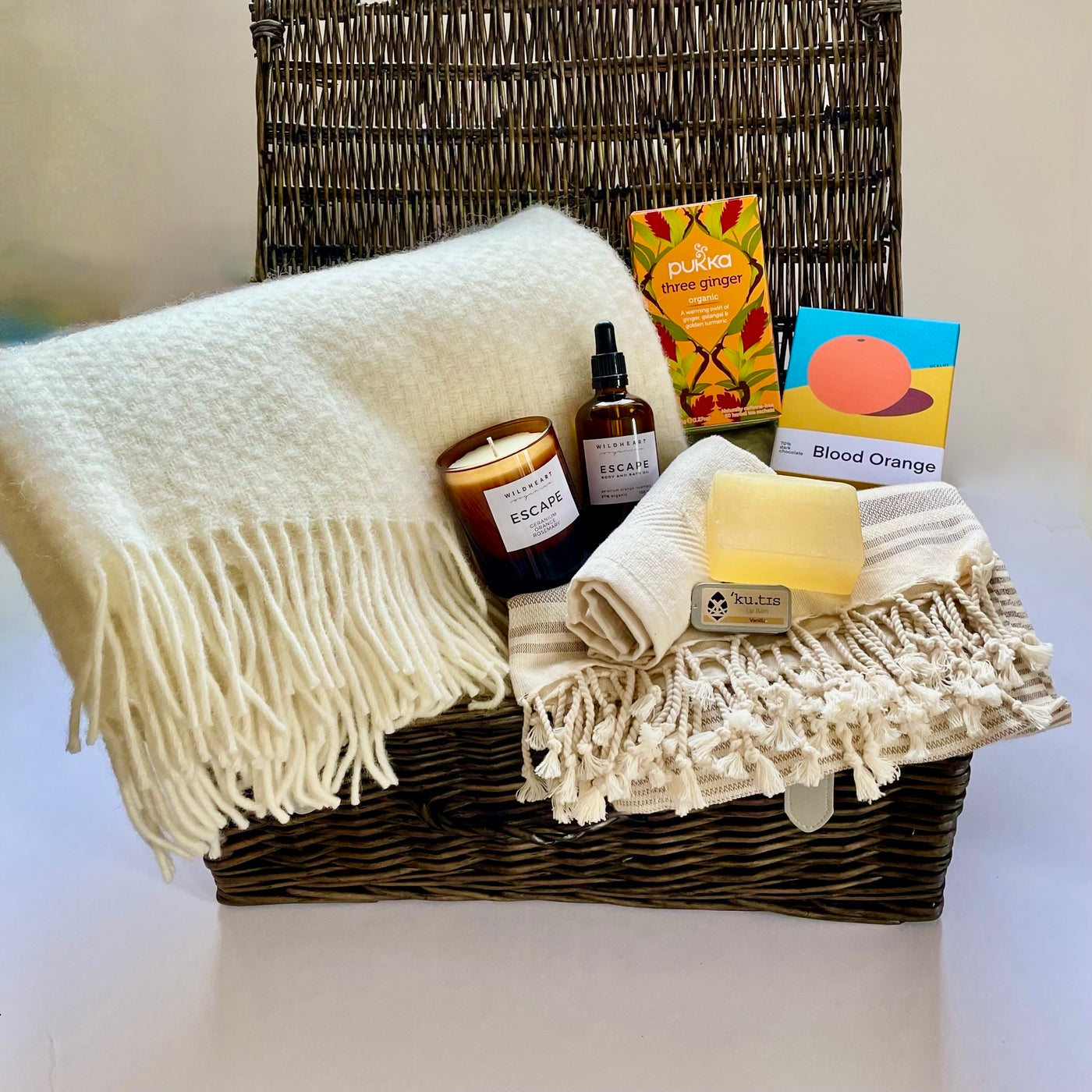 Rory & Ruby Luxury Pamper Hamper with ten gorgeous eco and organic goodies including a pure new wool throw, soy candle, bath and body oil and handwoven traditional wicker hamper.