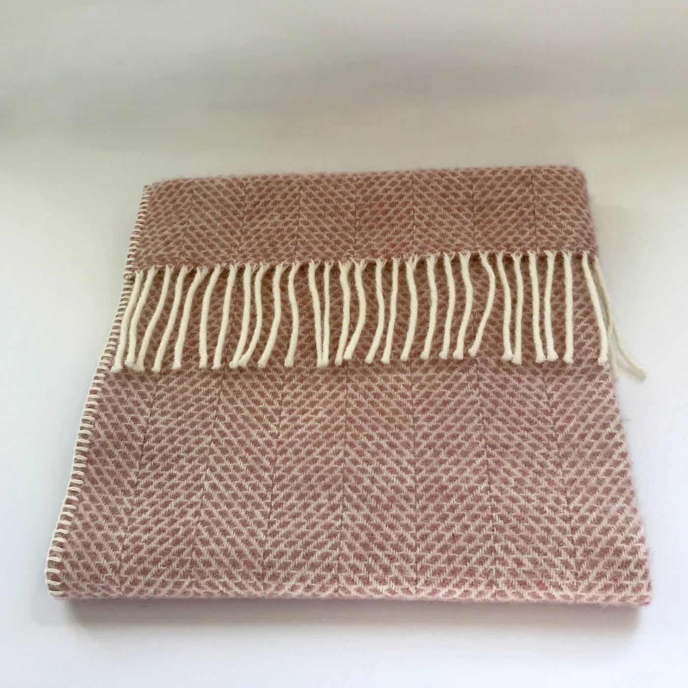 Rory & Ruby pure new wool fringed baby blanket in dusky pink.