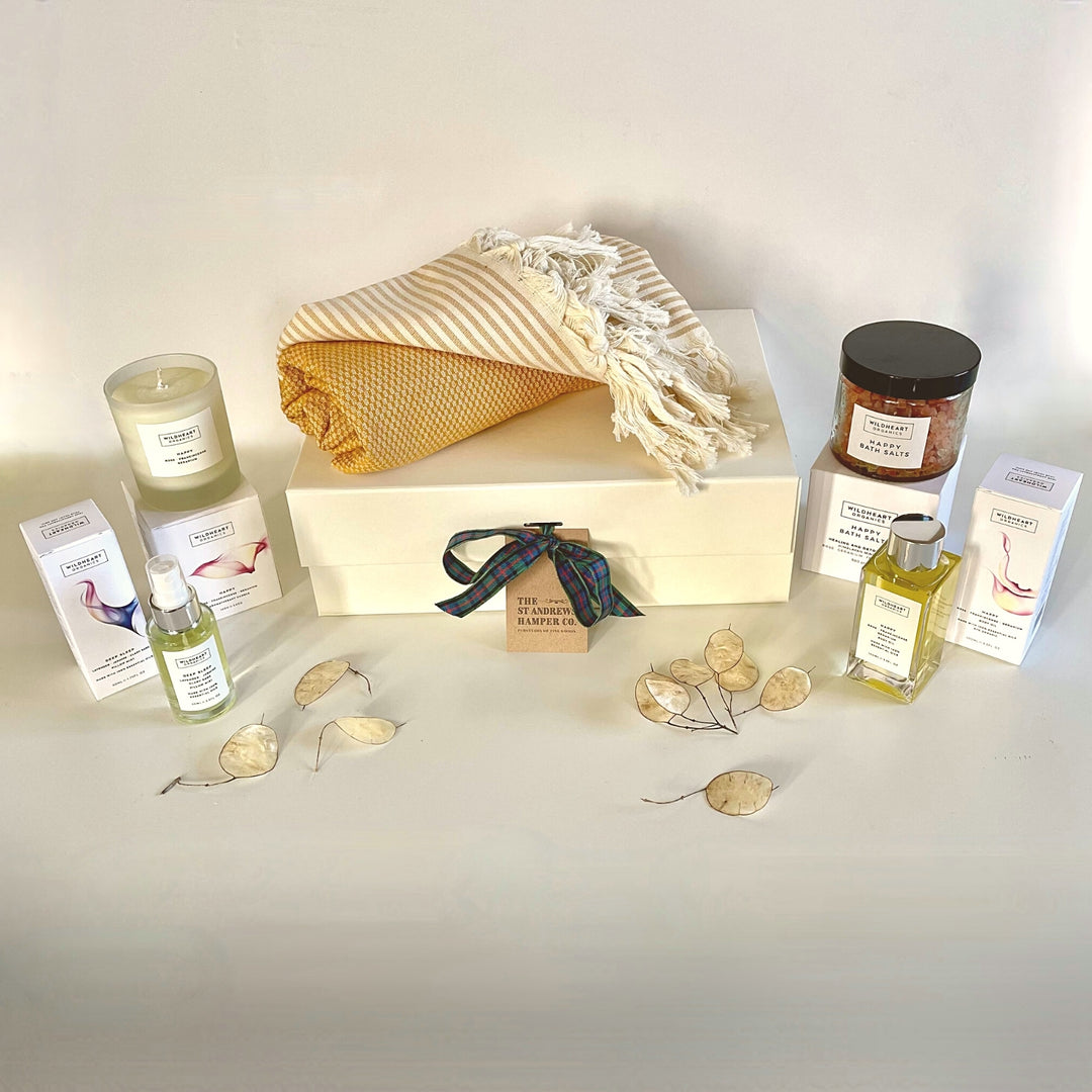 Indulgent Relax and Recharge Pamper Hamper from The St Andrews Hamper Company, filled with pure, natural organic spa candle, bath salts, body oil and pillow mist, plus an eco cotton hammam towel in terracotta, all beautifully presented in a luxury keepsake gift box.